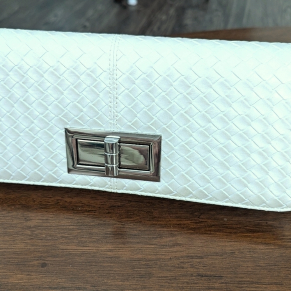 White clutch bag with silver toggle